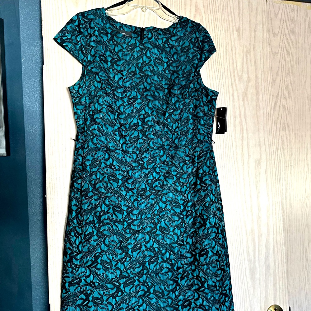 Black lace over teal dress